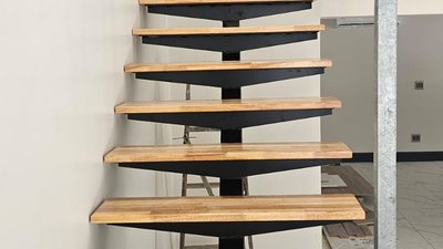 A floating timber staircase with cantilevered treads.