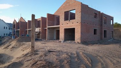 Brickwork rising on a multi-unit residential development.