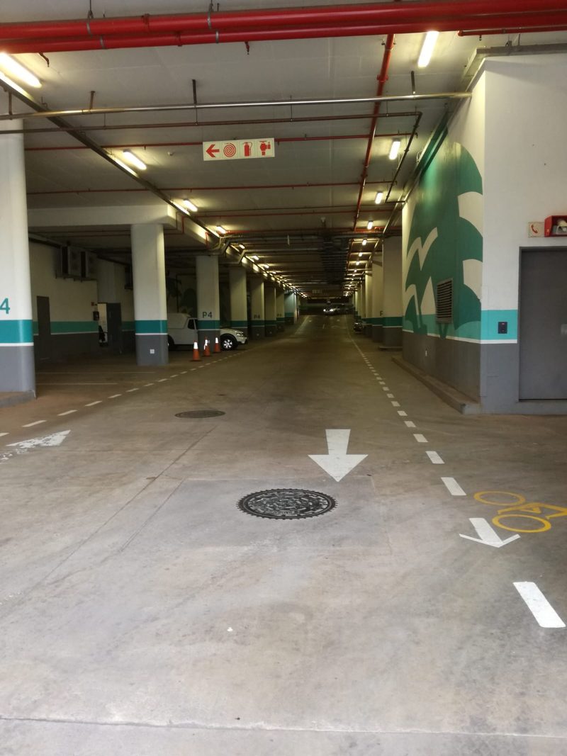 A refurbished basement parking deck with fresh floor markings.